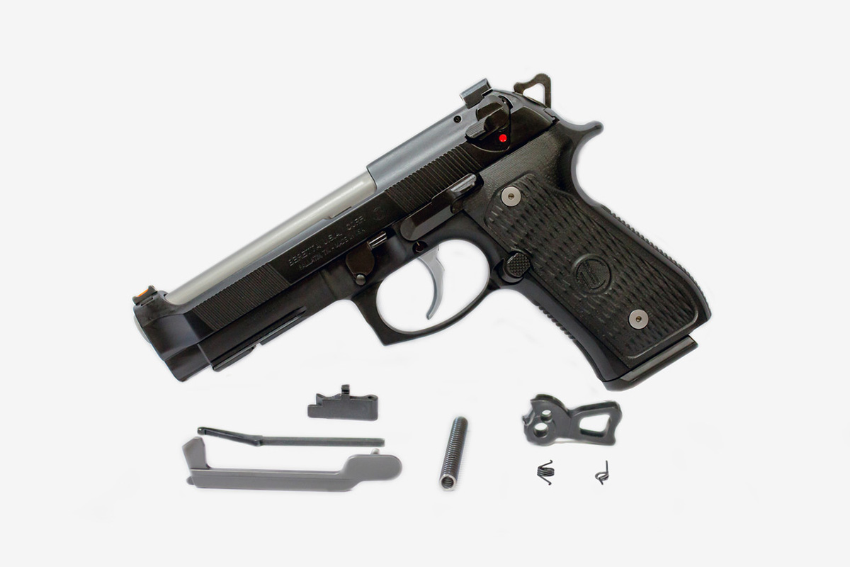 Beretta pistol with upgraded trigger components