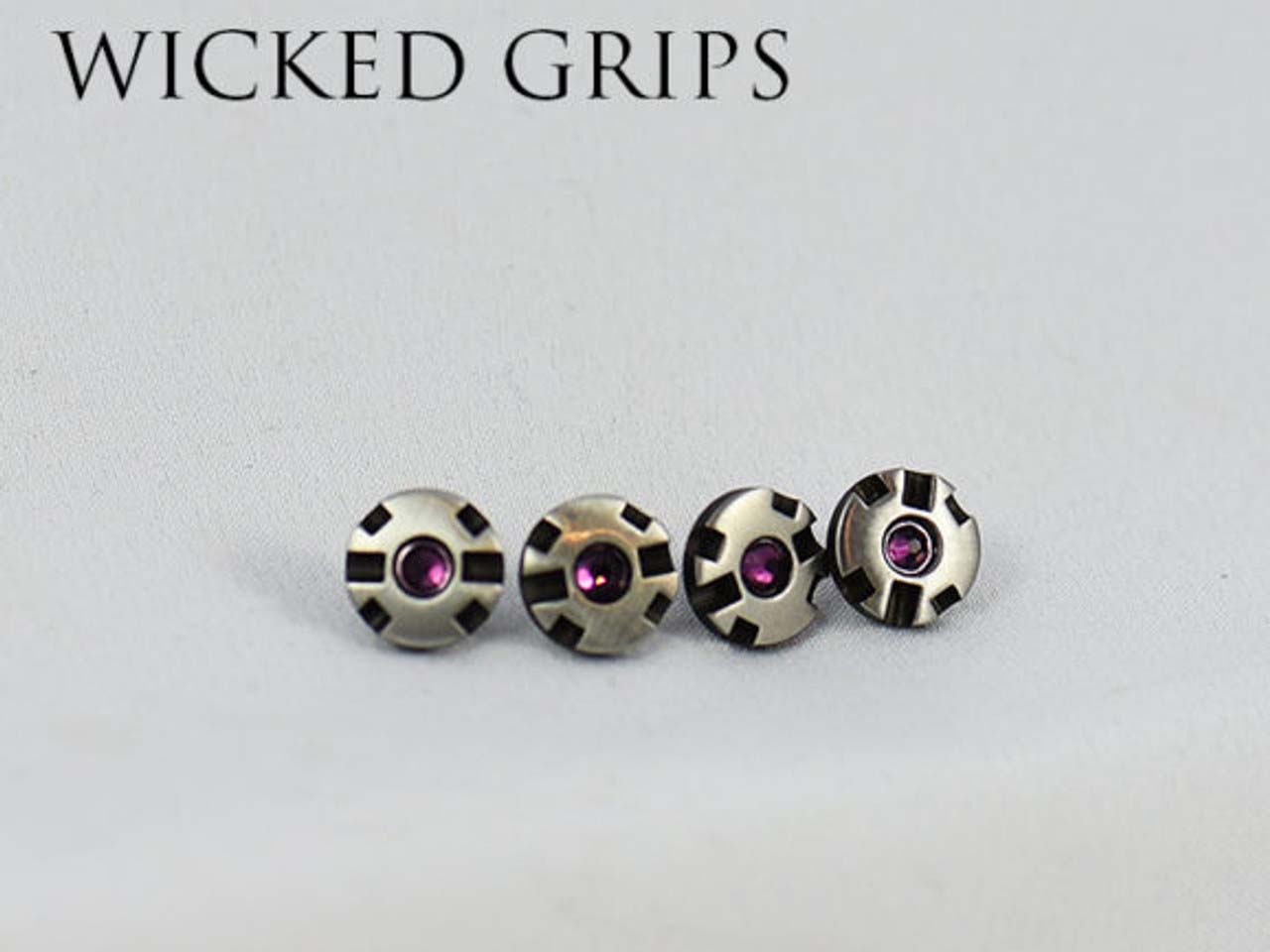 Four jewel-set custom grip screws